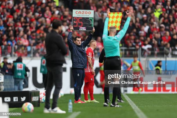 Substitution board displaying the message 'Stop Racism' in support of the International week against racism during the Bundesliga match between...