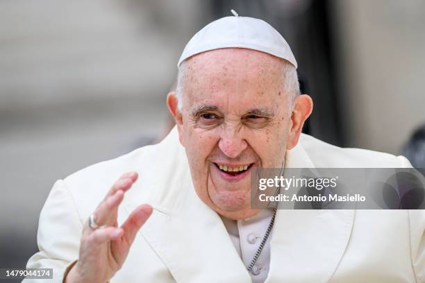 Pope Francis waves to the faithful during the Palm Sunday Mass at St. Peter's Square on April 2, 2023 in Vatican City, Vatican. The 86-year-old...