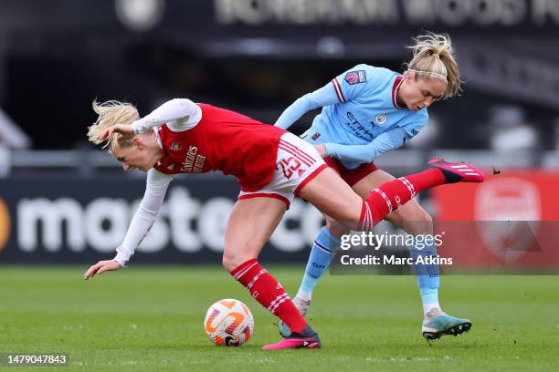 Stina Blackstenius of Arsenal is challenged by Steph Houghton of Manchester City during the FA Women's Super League match between Arsenal and...