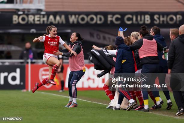 Katie McCabe of Arsenal celebrates with teammates after scoring the team's second goal during the FA Women's Super League match between Arsenal and...
