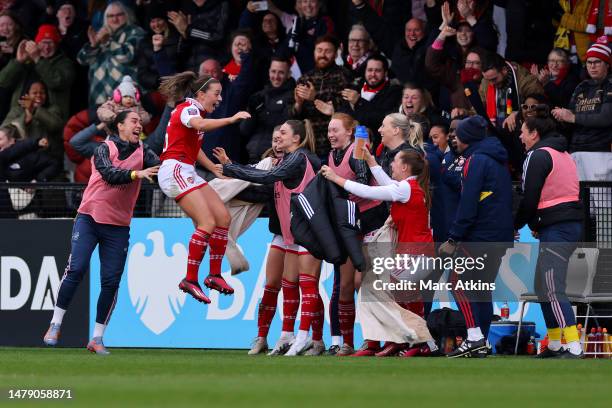 Katie McCabe of Arsenal celebrates with teammates after scoring the team's second goal during the FA Women's Super League match between Arsenal and...