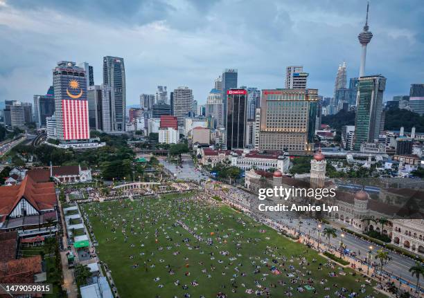 An area view of Muslims breaking fast at Dataran Merdeka during the holy month of Ramadan on April 02, 2023 in Kuala Lumpur, Malaysia. Muslims around...