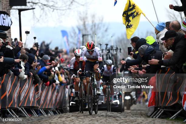 Axel Zingle of France and Team Cofidis, Nils Politt of Germany and Team BORA-Hansgrohe and Tadej Pogacar of Slovenia and UAE Team Emirates compete at...