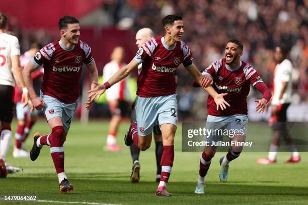 Nayef Aguerd of West Ham United celebrates with teammates Declan Rice and Said Benrahma after scoring the side's first goal during the Premier League...