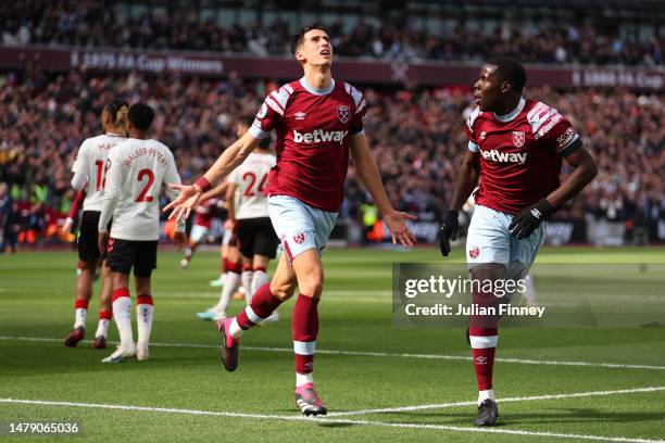 Nayef Aguerd of West Ham United celebrates with teammate Kurt Zouma after scoring the side's first goal during the Premier League match between West...