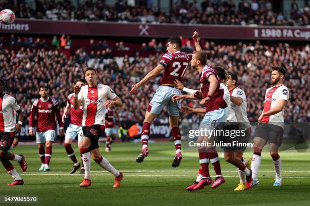 Nayef Aguerd of West Ham United scores the side's first goal during the Premier League match between West Ham United and Southampton FC at London...