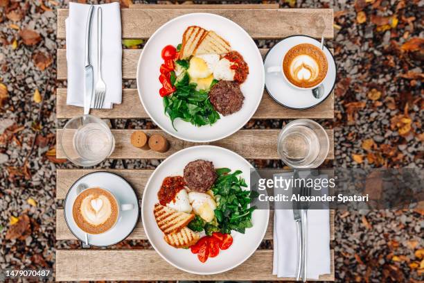 healthy lunch at the cafe, high angle view - cutlet stockfoto's en -beelden