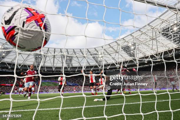 Gavin Bazunu of Southampton fails to save a header as Nayef Aguerd of West Ham United scores the teams first goal during the Premier League match...