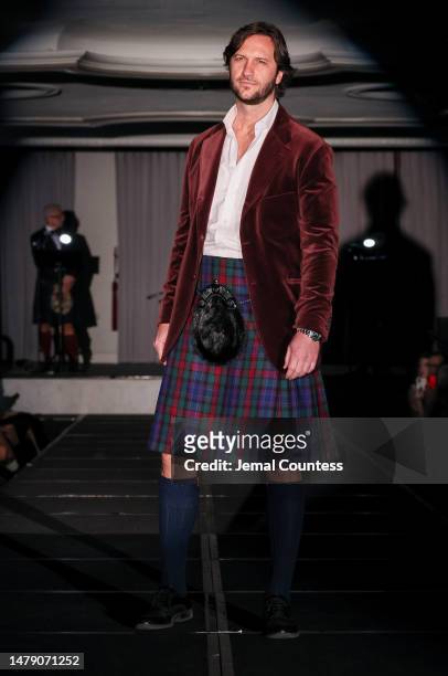 Model wears a special kilt designed by Sir Sean Connery on the runway at the Dressed to Kilt 20th Anniversary Fashion show & Gala at Omni Shoreham...