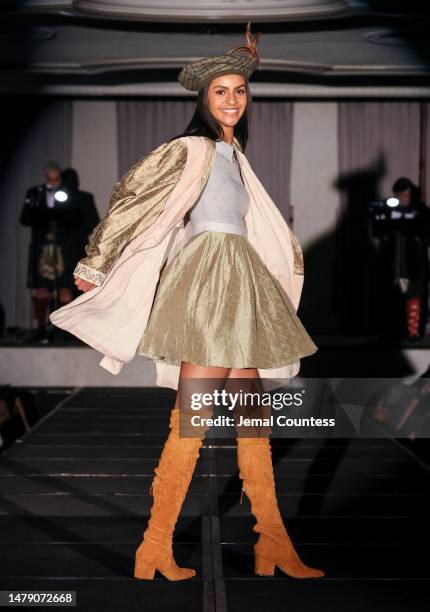 Model wears Prophetik on the runway at the Dressed to Kilt 20th Anniversary Fashion show & Gala at Omni Shoreham Hotel on April 01, 2023 in...