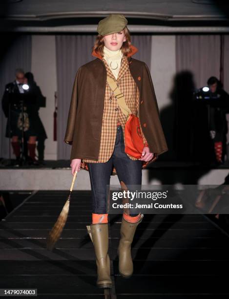 Model wears Horse Country on the runway at the Dressed to Kilt 20th Anniversary Fashion show & Gala at Omni Shoreham Hotel on April 01, 2023 in...