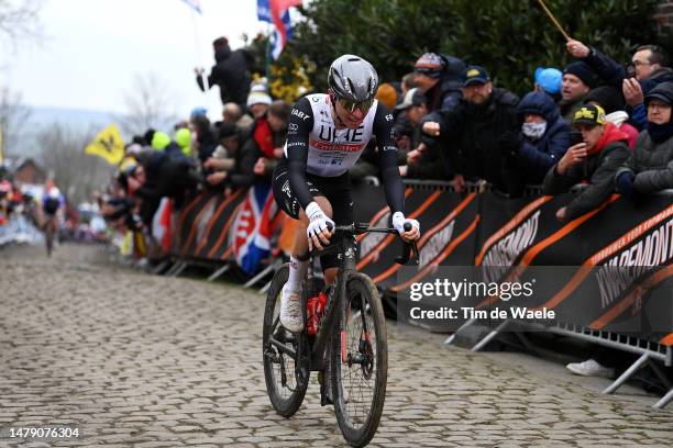 Tadej Pogacar of Slovenia and UAE Team Emirates competes at Oude Kwaremont cobblestones sector during the 107th Ronde van Vlaanderen - Tour des...