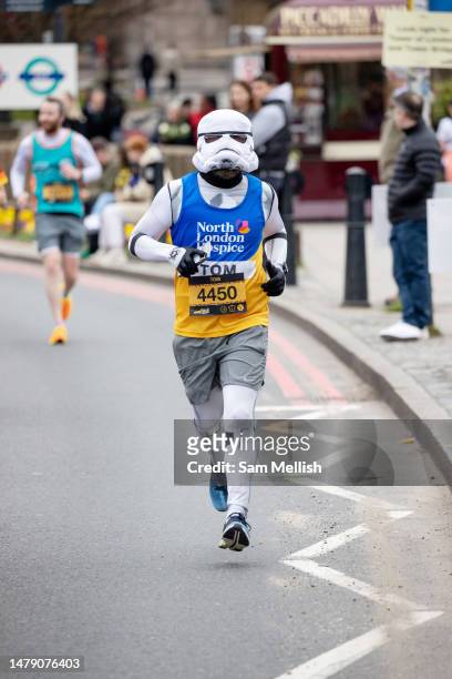 Man dressed as a Stormtrooper, a fictional character from the film Star Wars, takes part in the London Landmarks Half Marathon on April 02, 2023 in...