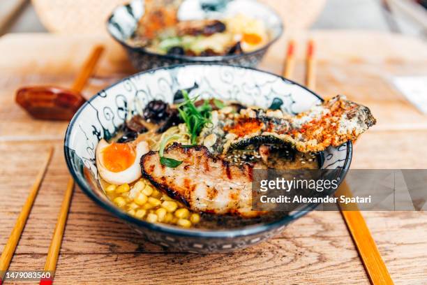 pork ramen noodle soup in a bowl, close-up view - cooked eggs stock pictures, royalty-free photos & images
