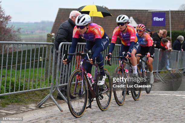 Marlen Reusser of Switzerland, Lotte Kopecky of Belgium and Team SD Worx and Silvia Persico of Italy and UAE Team ADQ compete passing through a...