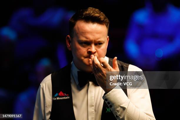 Shaun Murphy of England reacts in the semi-final match against Mark Selby of England on day six of Tour Championship Snooker 2023 at the Bonus Arena...