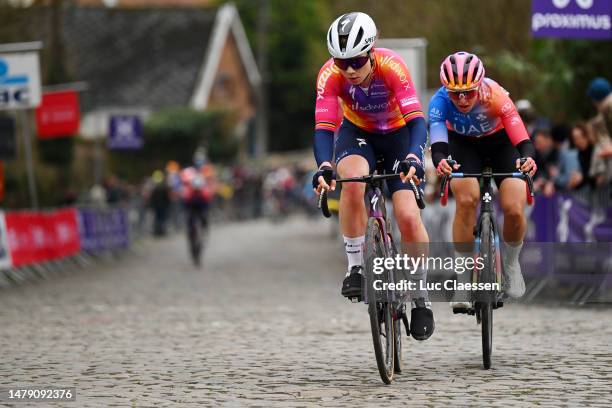 Lotte Kopecky of Belgium and Team SD Worx and Silvia Persico of Italy and UAE Team ADQ compete in the breakaway competes during the 20th Ronde van...