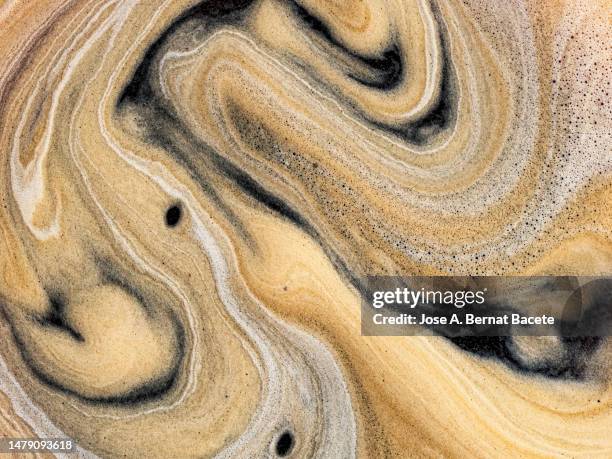 full frame of cream and textures of a freshly brewed espresso cup. - chocolate swirl from above stock pictures, royalty-free photos & images