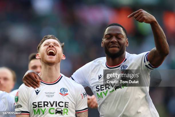 Gethin Jones of Bolton Wanderers celebrates with teammate Ricardo Santos after scoring the team's fourth goal during the Papa John's Trophy Final...