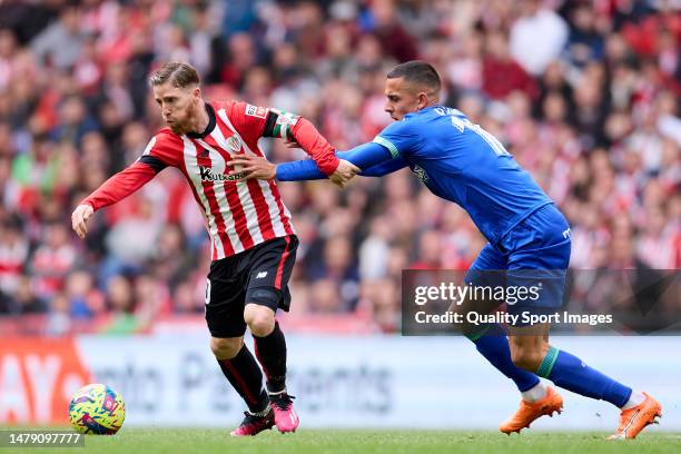 Iker Muniain of Athletic Club hurt for the ball with Angel Algobia of Getafe CF during the LaLiga Santander match between Athletic Club and Getafe CF...