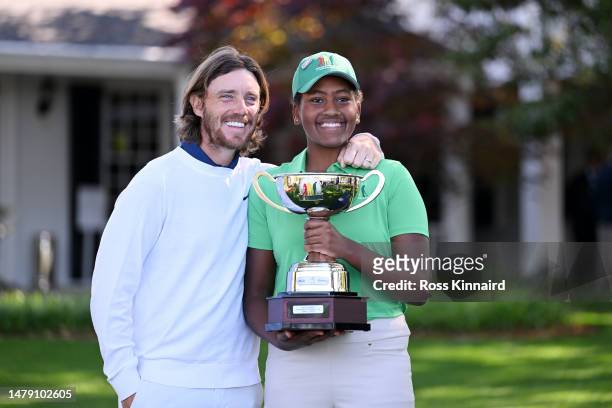 Overall winner Maya Palanza Gaudin of the Girls 12-13 group poses with Tommy Fleetwood of England during the Drive, Chip and Putt Championship at...
