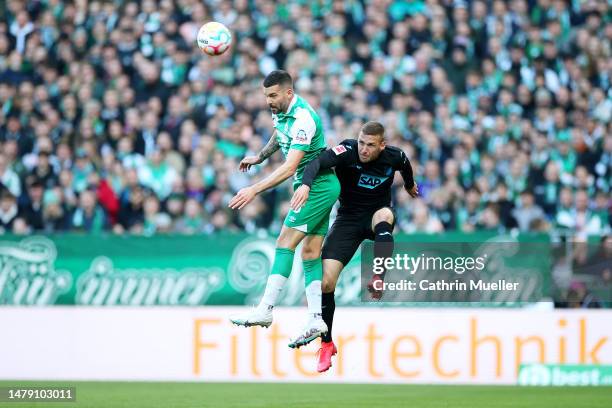 Niklas Stark of SV Werder Bremen contends for the aerial ball with Pavel Kaderabek of TSG Hoffenheim during the Bundesliga match between SV Werder...