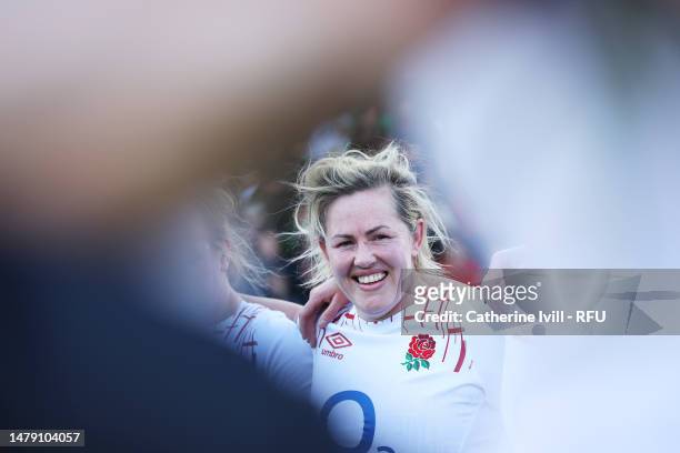 Marlie Packer of England looks on as players of England huddle after victory over Italy during the TikTok Women's Six Nations match between England...