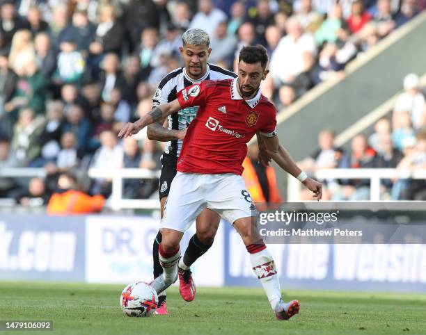 Bruno Fernandes of Manchester United in action with Bruno Guimaraes of Newcastle United during the Premier League match between Newcastle United and...