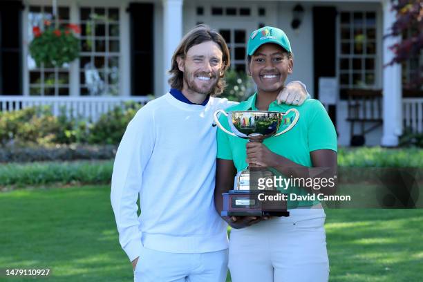 Maya Palanza Gaudin of The United States the Girls 12-13 year group overall champion poses with her trophy and Tommy Fleetwood of England during the...