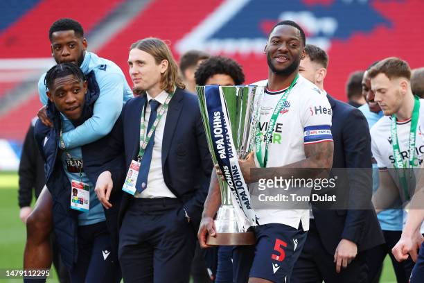 Ricardo Santos of Bolton Wanderers carries the Papa John's Trophy following their victory in the Papa John's Trophy Final between Bolton Wanderers...