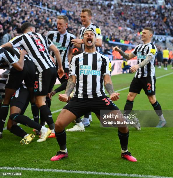 Bruno Guimaraes of Newcastle United celebrates after teammate Joe Willock scores the teams first goal during the Premier League match between...