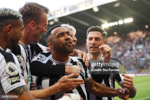 Callum Wilson of Newcastle United celebrates with teammates after scoring the teams second goal during the Premier League match between Newcastle...