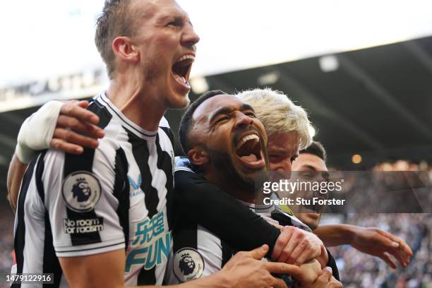 Callum Wilson of Newcastle United celebrates with teammates after scoring the teams second goal during the Premier League match between Newcastle...