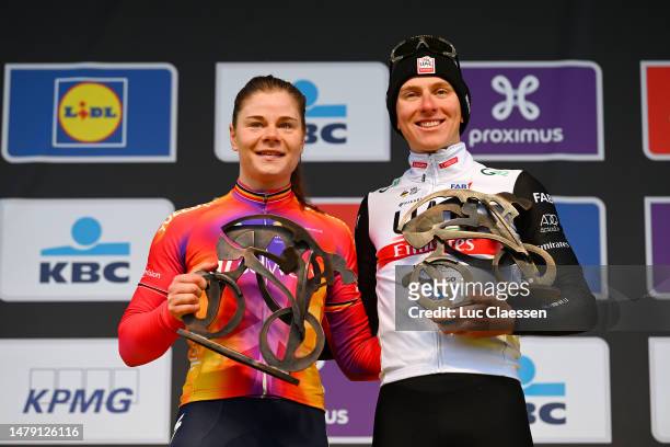 Lotte Kopecky of Belgium and Team SD Worx and Tadej Pogacar of Slovenia and UAE Team Emirates celebrate at podium as race winners during the 20th...