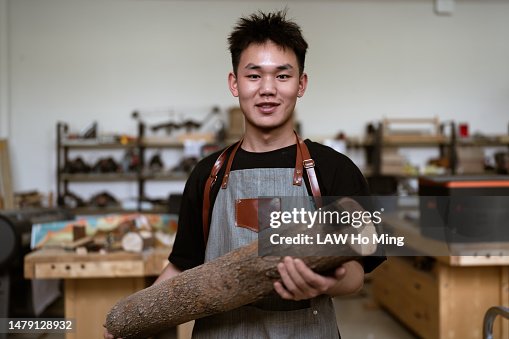 A young carpenter at work in his workshop