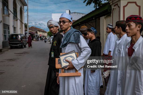 Students walk after they learn Islamic scriptures in the Islamic boarding school Al-Fatah Temboro during the holy month of Ramadan on April 02, 2023...