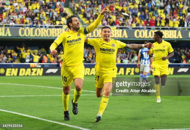 Daniel Parejo of Villarreal CF celebrates with teammate Yeremi Pino after scoring the team's first goal during the LaLiga Santander match between...