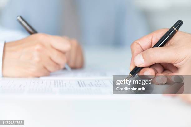 signing agreement - merging stock pictures, royalty-free photos & images