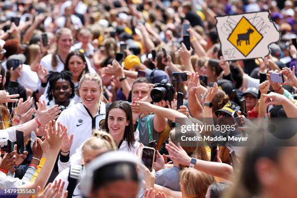 Caitlin Clark of the Iowa Hawkeyes walks into the stadium on the red carpet before playing against the LSU Lady Tigers during the 2023 NCAA Women's...