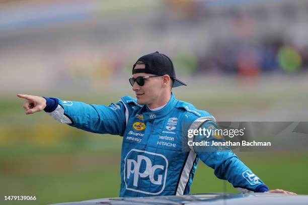 Josef Newgarden, driver of the PPG Team Penske Chevrolet, gestures to fans during a parade lap prior to the NTT IndyCar Series PPG 375 at Texas Motor...