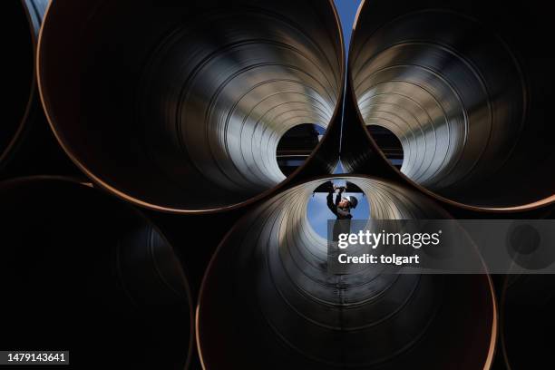 engineer checking industrial pipes - steel pipe stock pictures, royalty-free photos & images