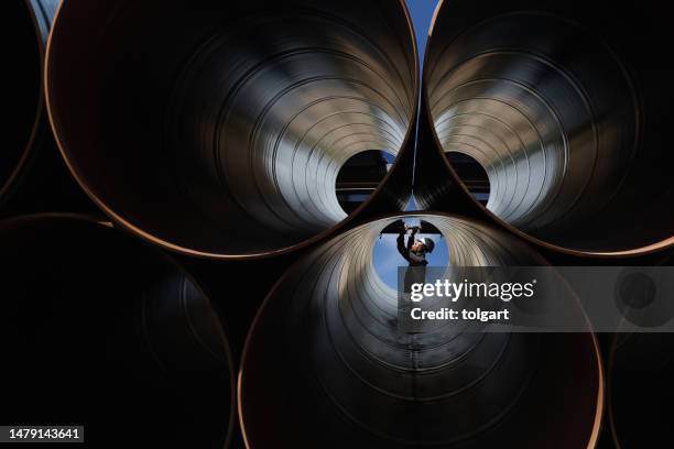 engineer checking industrial pipes - conduit pipe stock pictures, royalty-free photos & images