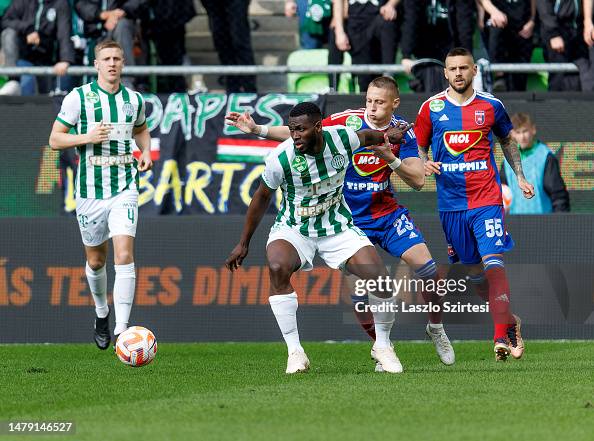 Palko Dardai of MOL Fehervar FC challenges Anderson Esiti of