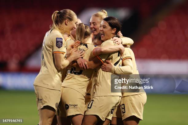 Sam Kerr of Chelsea celebrates with teammates after scoring the side's third goal during the FA Women's Super League match between Aston Villa and...