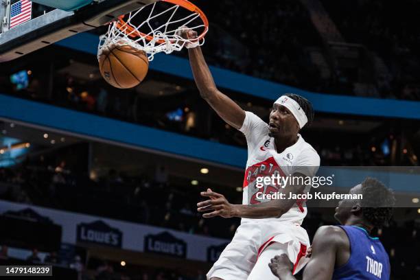 Chris Boucher of the Toronto Raptors dunks the ball against the Charlotte Hornets in the fourth quarter during their game at Spectrum Center on April...