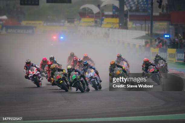 Race start! Marco Bezzecchi of Italy and Mooney VR46 Racing Team rides next to Franco Morbidelli of Italy and Monster Energy Yamaha MotoGP at turn...