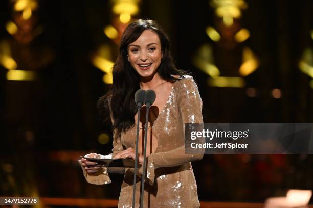 Helen George presents the Best Entertainment or Comedy Play and the Best Family Show awards onstage at The Olivier Awards 2023 at the Royal Albert...