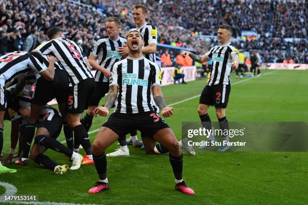 Bruno Guimaraes of Newcastle United celebrates after teammate Joe Willock scores the teams first goal during the Premier League match between...