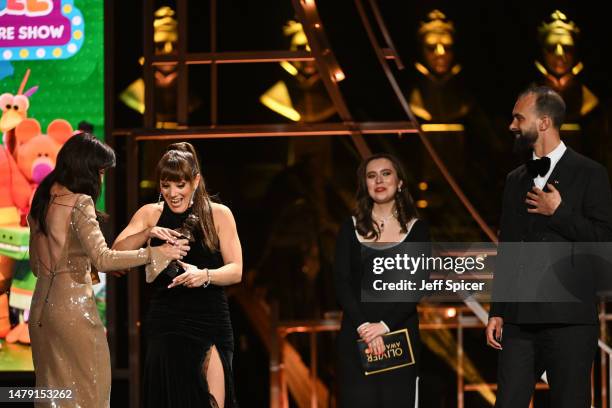 Vikki Stone and Matthew Xia accept the Best Family Show award for “Hey Duggee: The Live Theatre Show” from Helen George onstage at The Olivier Awards...