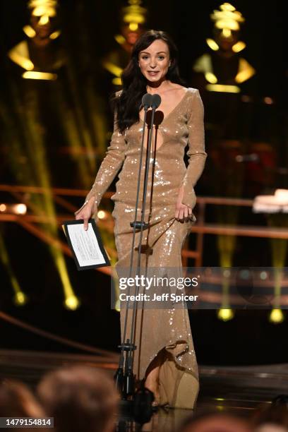 Helen George presents the Best Entertainment or Comedy Play and the Best Family Show awards onstage at The Olivier Awards 2023 at the Royal Albert...